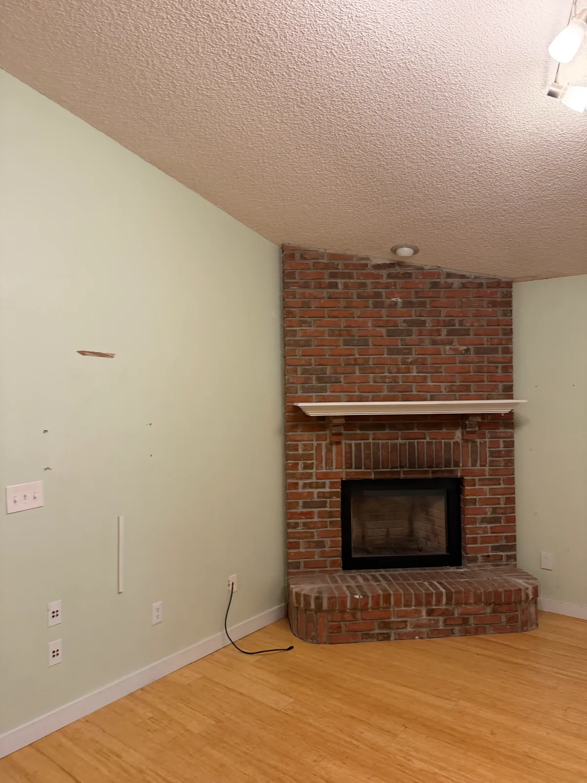 Living room and fireplace before transformation in Duval County, FL