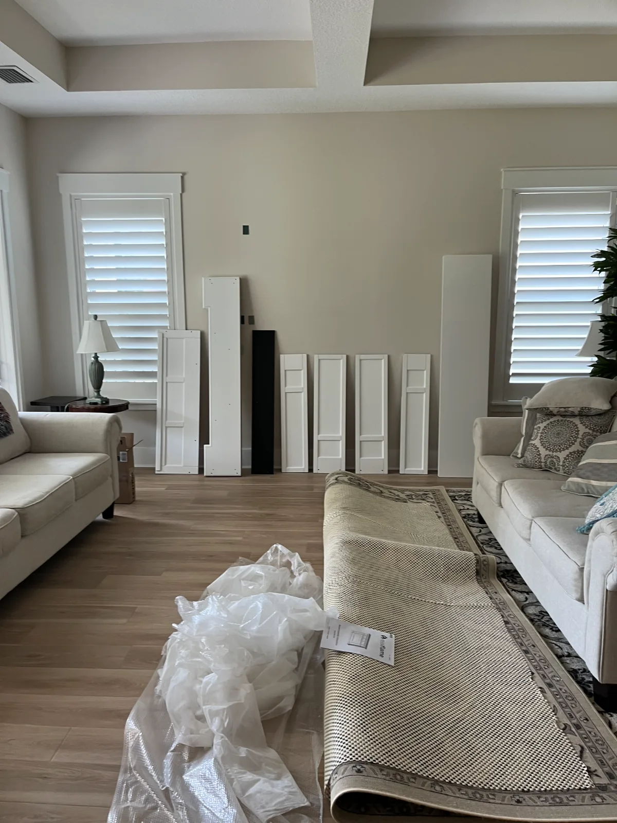 Living room before electric fireplace and TV wall mount installation in Nocatee, FL