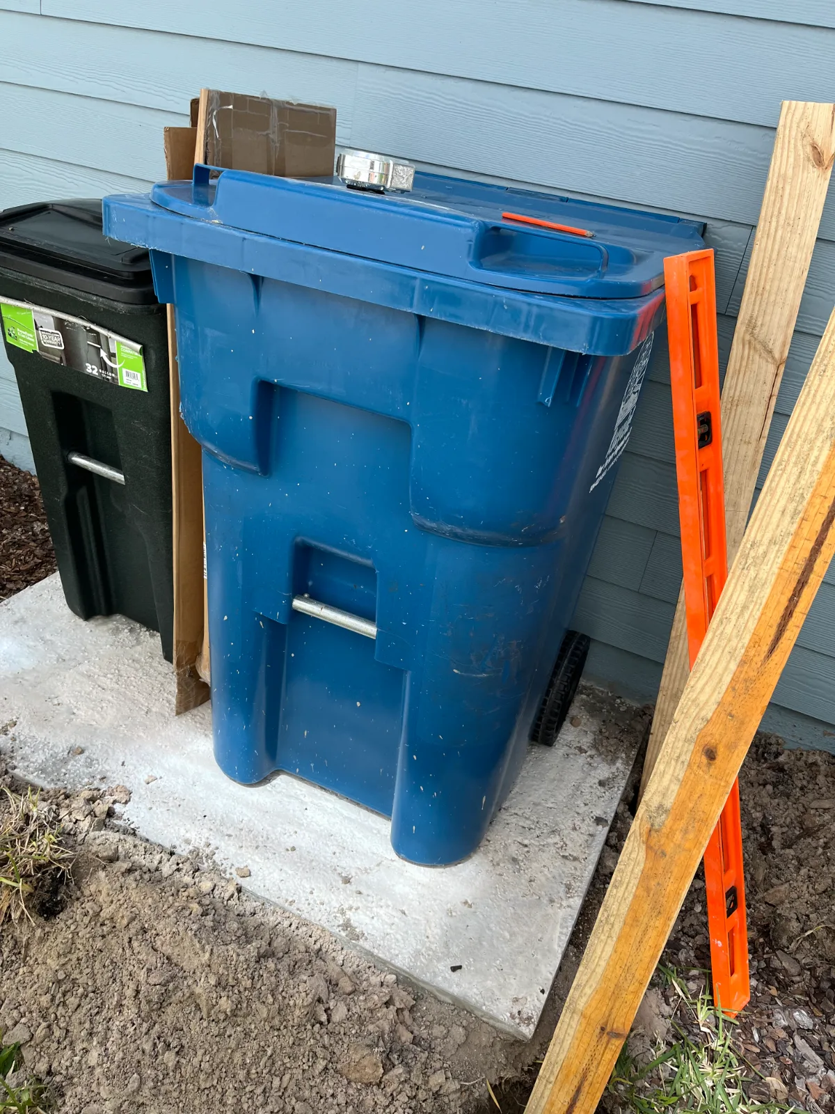 Side yard before concrete flooring and garbage can enclosure in St. Johns, FL