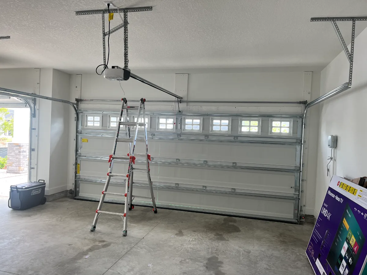 Garage before overhead storage rack installation above garage door in Nocatee, FL