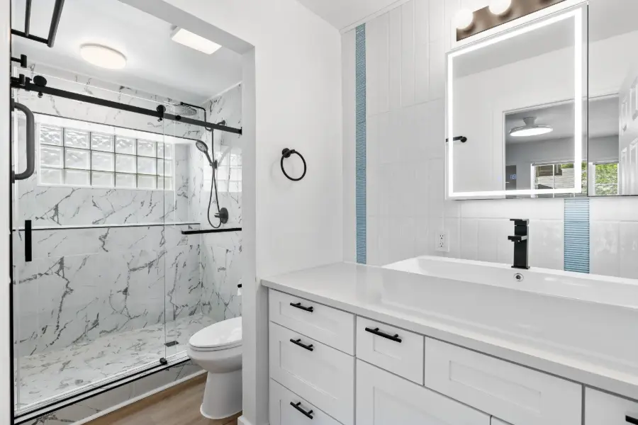 Fully remodeled bathroom with marble shower and vanity